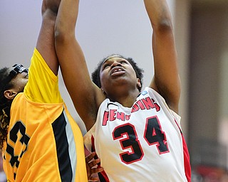 YOUNGSTOWN, OHIO - MARCH 7, 2015: Tisha Walker #32 of YSU puts up a shot over Sharon Karungi #33 of Valpo during the 1st half of Saturday afternoons NCAA basketball game at Beeghly Center. (Photo by David Dermer/Youngstown Vindicator)