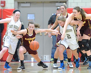 Jeff Lange | The Vindicator  Raiders' Jordon Youngs (left center) chases down a loose ball with Brookfield's Madison Bellis (left), McKenzie Drapola (2) and teammates Ashley Sharp and Sara Durr (right) in the second quarter of their matchup at Struthers Fieldhouse, Saturday afternoon.