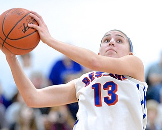Jeff Lange | The Vindicator  Reserve's Rachel Maslach looks to the basket as she attempts a layup during the Blue Devils' matchup with Jackson Milton, Saturday afternoon at Mineral Ridge.