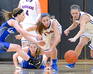 Jeff Lange | The Vindicator  Jackson Milton's Ashley Totani (left) and Reserve's Rachel Maslach (center), Sydney Miller (right) race for the ball as Jays' Olivia Wolfe (on the floor) watches the play from behind during second half action at Mineral Ridge, Saturday.