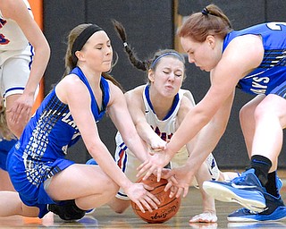 Jeff Lange | The Vindicator  Reserve's Sydney Miller (center) fights for the ball with Jackson Milton's Ashley Totani (left) and Izzy Scarl (right) during their game, Saturday afternoon at Mineral Ridge High School.