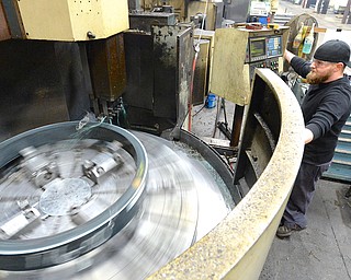 Jeff Lange | The Vindicator  John Sweesy of Youngstown operates one of Brilex Industries' VTL turning lathes during work, Monday morning in Youngstown.