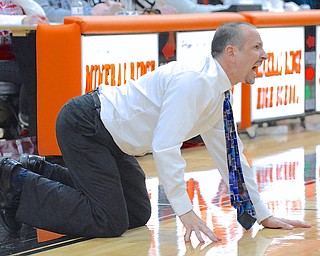 Jeff Lange | The Vindicator  Reserve head coach Steve Miller coaches his girls from the floor in the final seconds of Reserve's game against Jackson Milton at Mineral Ridge High School, Saturday.