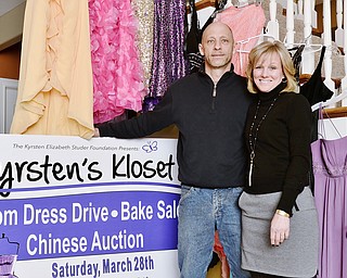 Jeff Lange | The Vindicator  Bryan and Jennifer Studer shown with a few samples of the hundreds of prom dresses which will be given away on March 28th and 29th at St. Patricks Parish Center in Hubbard in honor of their daughter Kyrsten who was killed by a drunk driver 11 years ago.