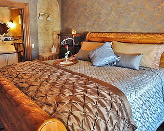 Jeff Lange | The Vindicator  An elegantly furnished bedroom which is titled the Currier and Ives Room. The room is named after a famous pattern made by Royal China of Sebring.