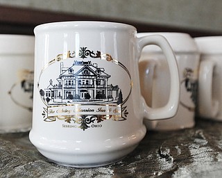 Jeff Lange | The Vindicator  Souvenir mugs which are given to those who stay overnight in one of the elegant rooms in the Sebring Mansion Inn & Spa.