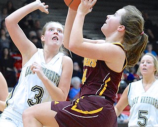 Jeff Lange | The Vindicator  South Range's Jordon Youngs looks to the basket for two over the defense of Brookfield's Autumn Kirila (3) during their Saturday-afternoon game in Struthers.