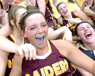 Jeff Lange | The Vindicator  Raiders' Ashley Sharp (top) celebrates with her teammates in a pileup after the game against Brookfield, Saturday afternoon.