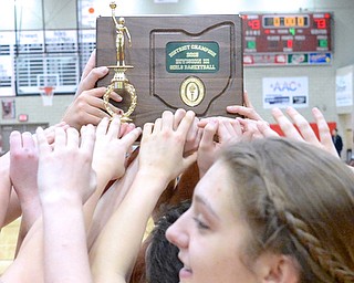 Jeff Lange | The Vindicator  South Range girls hold up the District Championship plaque after their 73-43 victory against Brookfield, Saturday in Struthers.