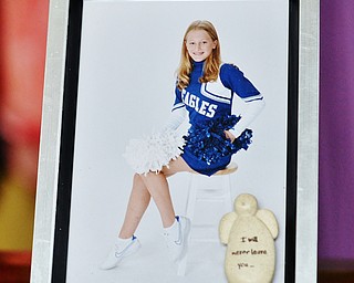 Jeff Lange | The Vindicator  A cheerleading photo of Kyrsten Studer in a frame that reads "I will never leave you."