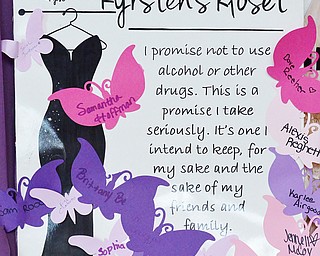 Jeff Lange | The Vindicator  The pledge taken by all of the girls who get a dress from Kyrsten's Kloset. The dresses are free to anyone as long as they sign their name promising not to drink or do drugs.