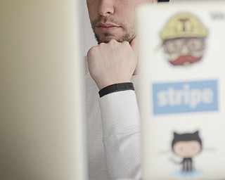 Katie Rickman | The Vindicator.Mike Helmick of Girard is a Lead Engineer for Drund, he works on coding at the office on March 5, 2015.