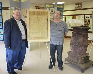 Katie Rickman | The Vindicator.Scott Conway (left) and Keith Frye both members of Beaver Twp. Historical Society stand next to an old map of Ohio in the new location of the society which is in The North Lima Business Complex in North Lima on March 5, 2015.