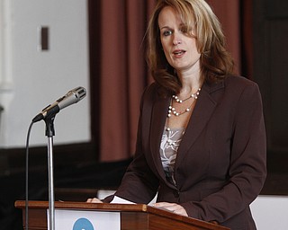        ROBERT K. YOSAY  | THE VINDICATOR..Danielle Cantrell, vice pres Cortland Banks, domestic violence survivor..Speakers at VIP Family Violence Prevention CoalitionÕs Partnership with the National NO MORE PSA campaign. at St Johns Episcopal Church ..Jim Tressel, YSU pres, and Danielle Cantrell, vice pres Cortland Banks, domestic violence survivor.Vince M. Brancaccio- Help Hotline ...