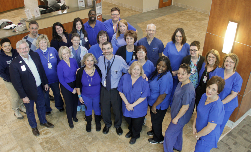        ROBERT K. YOSAY  | THE VINDICATOR..Dr william Lee is in the center with a tie. to his right our left is his latest patient  (black Sleves) Jill Lewis...of Canfield a cancer survivor.. Friday is national Dress in Blue Day (March is Colorectal Cancer Awareness month) at Northside Medical Center. We are encouraging our staff to wear blue to bring attention to colon cancer and celebrate the courage of those affected by this disease..This event is being organized in conjunction with Dr. William Lee, board-certified general surgeon. He is an advocate of the Colon Cancer Alliance, the national organization that helps raise awareness for Colorectal Cancer. Dr. Lee is a ValleyCare Medical Group of Ohio physician and a member of the medical staff at Northside Medical Center..Dr. Lee, his staff and a recent patient of his will be gathering at 1 p.m. tomorrow in the new lobby at Northside Medical Center to take a group photo for Dress in Blue Day. Dr. Lee will also be on hand for interviews....