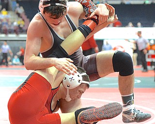 Jeff Lange | The Vindicator  Boardman's Anthony Mancini (top) gets on top of opponent Alex Sepeda of Marysville during their 160 pound Division I matchup in Columbus during preliminaries of the state tournament, Thursday afternoon.