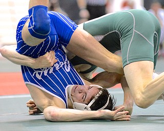 Jeff Lange | The Vindicator  Jackson Milton's Mitch Tikkanen (left) is flipped to the mat by Johnstown Northridge's Jake Adkins during their 113 pound Division III state matchup, Thursday afternoon in Columbus.