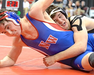 Jeff Lange | The Vindicator  David-Brian Whisler (right) takes down Springfield Northwestern opponent Connor Rogers during their Division II 170 pound match at OSU during the state wrestling tournament, Thursday afternoon.