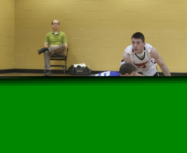 Hubbards Brett Lopuchovsky dives for a steal in the first quarter as Canfields #14 Mike Yourstowsky  pulls the ball out of reach. .ROBERT  K. YOSAY | THE VINDICATOR