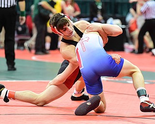 COLUMBUS, OHIO - MARCH 13, 2015: Georgio Poullas of Canfield attempts to keep his balance while stuffing the take down attempt by Devin Rogers of Northwestern during their 126lb championship round bout Friday night at Schottenstein Center. (Photo by David Dermer/Youngstown Vindicator)