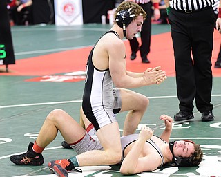 COLUMBUS, OHIO - MARCH 13, 2015: Kyle Lawson of St. Paris Graham Local claps his hands in celebration after finishing off David Crawford of Canfield after their 152lb championship round bout Friday night at Schottenstein Center. (Photo by David Dermer/Youngstown Vindicator)