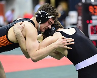 COLUMBUS, OHIO - MARCH 13, 2015: David-Brian Whisler of Howland grapples with Russell Miller of Miami Trace during their 170lb championship round bout Friday night at Schottenstein Center. (Photo by David Dermer/Youngstown Vindicator)