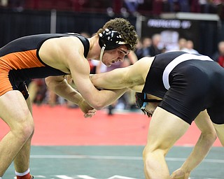 COLUMBUS, OHIO - MARCH 13, 2015: David-Brian Whisler of Howland grapples with Russell Miller of Miami Trace during their 170lb championship round bout Friday night at Schottenstein Center. (Photo by David Dermer/Youngstown Vindicator)