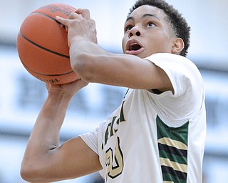 Jeff Lange | The Vindicator  Looking to the basket for two is Ursuline's Dave Collins during the first quarter of the Irish's Division III district final at Warren Harding, Friday evening.