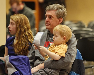       .         ROBERT  K. YOSAY | THE VINDICATOR..Brian Hetzel, Finnian,3 and  Alannnah watch as the BEE gets underway as they watch brother /son  Shane Hetzel from Triumphant Heart of of Mary Home School..The 82nd Regional Spelling Bee at Kilcawley Room at YSU .saw a repeat from last year as Annabelle Day bested over 50 other spellers Saturday Morning....-30-