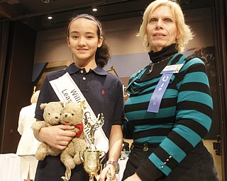       .         ROBERT  K. YOSAY | THE VINDICATOR..REPEAT BEE WINNER is  Annabelle Day of Willow Creek Learning Center  and Carol Ryan Judge ..The 82nd Regional Spelling Bee at Kilcawley Room at YSU .saw a repeat from last year as Annabelle Day bested over 50 other spellers Saturday Morning....-30-