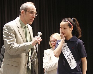       .         ROBERT  K. YOSAY | THE VINDICATOR..as the winner reacts -Moderator tim Roberts - announces the winner of the 82nd Bee  Annabelle Day.. her second time winning  The 82nd Regional Spelling Bee at Kilcawley Room at YSU .saw a repeat from last year as Annabelle Day bested over 50 other spellers Saturday Morning....-30-