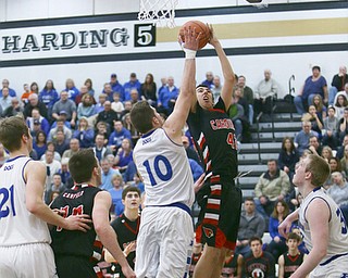 Mike Capps | The Vindicator.Tate Duarte (10) of Poland resists a shot from CanfieldÕs Sam DiGiacomo (42) during the 4th period as Poland beats Canfield 42-34..