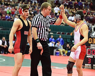 COLUMBUS, OHIO - MARCH 14, 2015: Georgio Poullas of Canfield reacts as Sandro Ramirez of Wauseon has his arm raised in victory by the referee after their 126lbs Division 2 consolation round bout Saturday morning at Schottenstein Center. (Photo by David Dermer/Youngstown Vindicator)