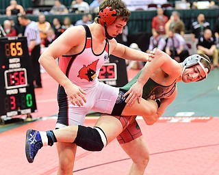 COLUMBUS, OHIO - MARCH 14, 2015: David Crawford of Canfield attempts to keep his balance while Josh Mossing works to kick out his leg from under him during their 152lb Division 2 consolation round bout Saturday morning at Schottenstein Center. (Photo by David Dermer/Youngstown Vindicator)