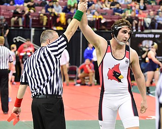 COLUMBUS, OHIO - MARCH 14, 2015: Jacob Esarco of Canfield has his arm raised in victory by the referee after his 220lb Division 2 consolation round bout Saturday morning at Schottenstein Center. (Photo by David Dermer/Youngstown Vindicator)