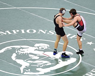 COLUMBUS, OHIO - MARCH 14, 2015: David Crawford of Canfield fights to keep his balance while Zack Lake of Akron Coventry goes for the take down during their 152lb Division 2 consolation round bout Saturday morning at Schottenstein Center. (Photo by David Dermer/Youngstown Vindicator)