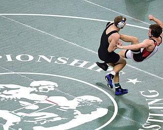 COLUMBUS, OHIO - MARCH 14, 2015: David Crawford of Canfield is taken down by Zack Lake of Akron Coventry during their 152lb Division 2 consolation round bout Saturday morning at Schottenstein Center. (Photo by David Dermer/Youngstown Vindicator)