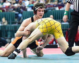 COLUMBUS, OHIO - MARCH 14, 2015: David-Brian Whisler of Howland looks at the clock while sprawling on the mat after a takedown attempt from Benjamin Schram of Bellbrook during their 170lb Division 2 championship round bout Saturday night at Schottenstein Center. (Photo by David Dermer/Youngstown Vindicator)