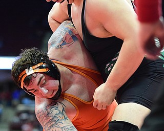 COLUMBUS, OHIO - MARCH 14, 2015: Seth Bloor of Wellsville attempts to grab the leg of Chance Veller of Delta during their 285lb Division 3 championship round bout Saturday night at Schottenstein Center. (Photo by David Dermer/Youngstown Vindicator)
