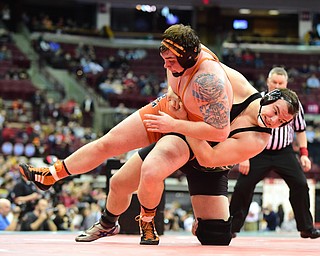 COLUMBUS, OHIO - MARCH 14, 2015: Chance Veller of Delta teas down Seth Bloor of Wellsville to the mat during their 285lb Division 3 championship round bout Saturday night at Schottenstein Center. (Photo by David Dermer/Youngstown Vindicator)