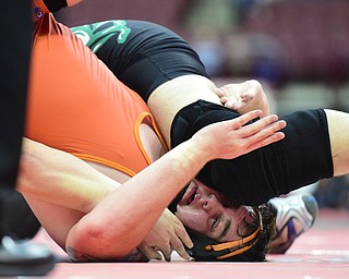 COLUMBUS, OHIO - MARCH 14, 2015: Seth Bloor of Wellsville takes a knee to the face from Chance Veller of Delta during their 285lb Division 3 championship round bout Saturday night at Schottenstein Center. (Photo by David Dermer/Youngstown Vindicator)