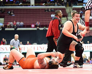 COLUMBUS, OHIO - MARCH 14, 2015: Chance Veller of Delta celebrates his victory while Seth Bloor of Wellsville lays on the mat after their 285lb Division 3 championship round bout Saturday night at Schottenstein Center. (Photo by David Dermer/Youngstown Vindicator)