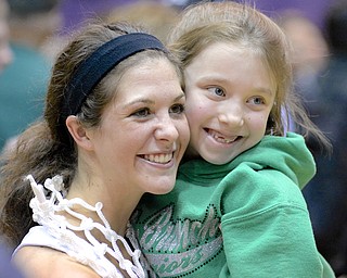 Jeff Lange | The Vindicator  West Branch's Kaylee Manning (left) holds up 7 year old Mati Hawk for a photo after the Lady Warriors victory, Saturday afternoon in Barberton.