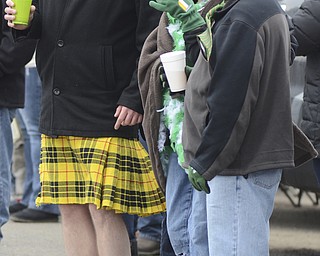 Katie Rickman | The Vindicator.Mike Hurl of Boardman (left) dances as the bagpipers pass by, his friends Denise Hetrick of Canfield and Lee Wolfe of North Jackson enjoy the parade in their St. Patrick's Day apparel on March 15, 2015.