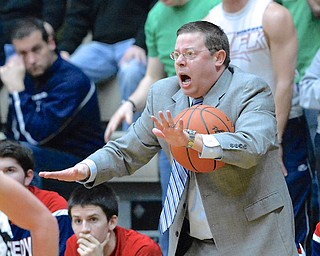 Jeff Lange | The Vindicator  John Richards, head coach for Warren JFK reacts to a call made by an official during second half action against St. Thomas Aquinas, Tuesday night at the Canton Fieldhouse.
