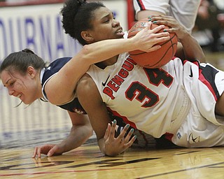 William D. Lewis The vindicator  YSU's Latisha Walker(34) and Duquesne's Olivia Bresnahan(22) go for a loose ball during 3-19-15 action at YSU.