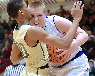 Jeff Lange | The Vindicator  Poland's Dan Black (right) collides with Akron's Henry Badly in the second half of their Division II regional semifinal matchup, Thursday afternoon at Canton Civic Center.