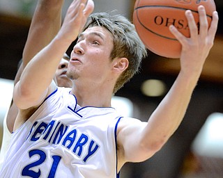 Jeff Lange | The Vindicator  Poland's Kyle Dixon looks to the basket as he attempts a two-point shot during first half action against St. Vincent - St. Mary, Thursday in their Division II regional matchup in Canton.