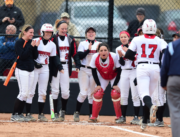 YOUNGSTOWN, OHIO - MARCH 20, 2015: Miranda Castiglione #17 of YSU is congratulated by her teammates after hitting a solo home run in the bottom of the 3rd inning during Friday evenings game at the YSU Softball Complex.(Photo by David Dermer/Youngstown Vindicator)