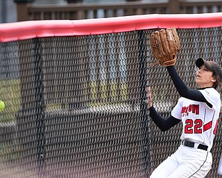 YOUNGSTOWN, OHIO - MARCH 20, 2015: Center fielder Hannah Lucas #22 of YSU runs into the outfield fence while chasing after a ball that would be a two run home run for Detroit in the top of the 3rd inning during Friday evenings game at the YSU Softball Complex.(Photo by David Dermer/Youngstown Vindicator)